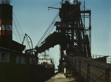 Loading a lake freighter with coal for shipment to other lake ports, Sandusky, Ohio, 1943. Creator: Jack Delano.