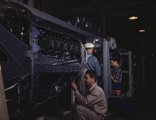 Employees at North American Aviation, Incorporated, assembling..., Inglewood, Calif., 1942. Creator: Alfred T Palmer.
