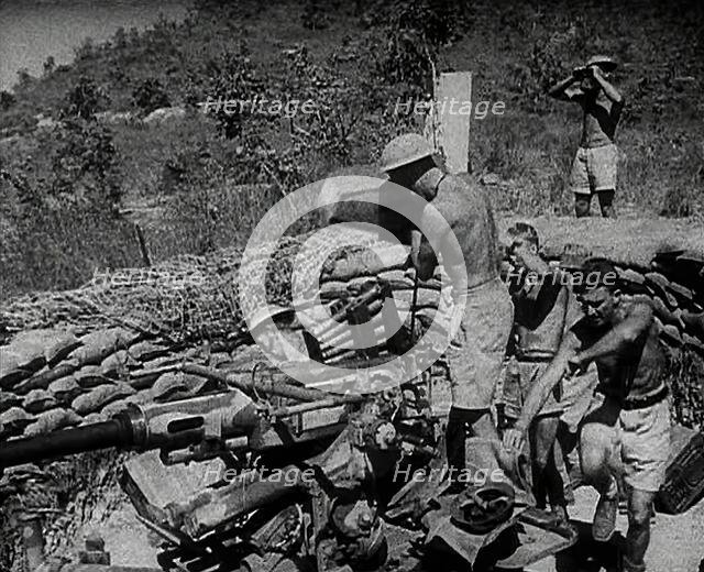 Commonwealth Troops Running to an Anti-Aircraft Gun, 1941. Creator: British Pathe Ltd.