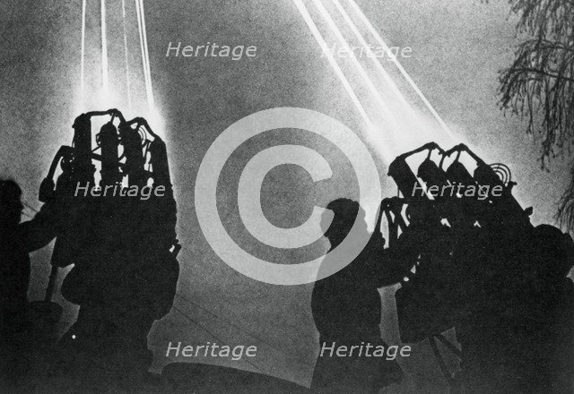 Searchlight operators preparing for a night bombing raid, Moscow, 1941. Artist: Unknown