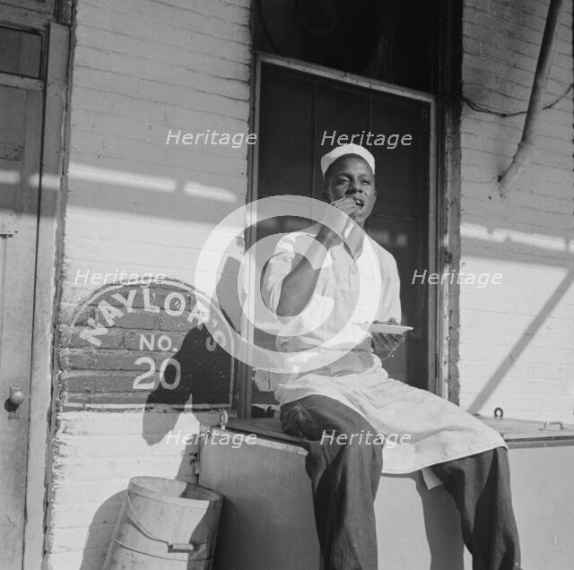 Washington, DC. A dishwasher who works in a waterfront restaurant, Washington, D.C., 1942. Creator: Gordon Parks.