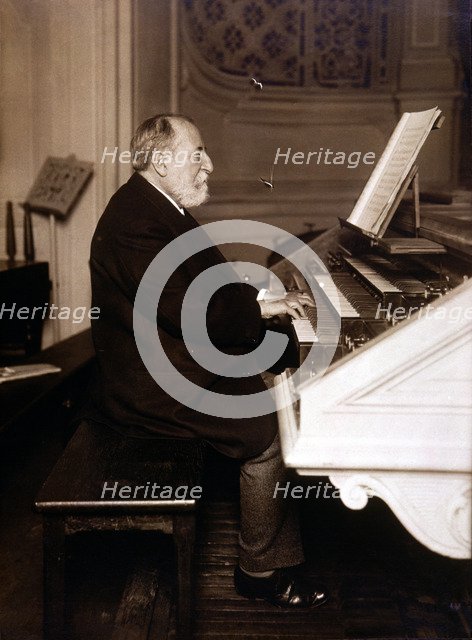Camille Saint-Saens (1835 - 1921), French composer, photography playing the organ.