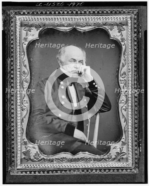 Ethan Allen Hitchcock, three-quarter length portrait, seated in chair..., between 1851 and 1860. Creator: Unknown.