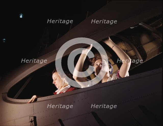American mothers and sisters, like these women at the Douglas Aircraft..., Long Beach, Calif. , 1942 Creator: Alfred T Palmer.