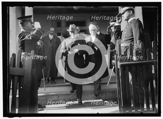 Woodrow Wilson descending steps with unidentified persons, between 1910 and 1917. Creator: Harris & Ewing.