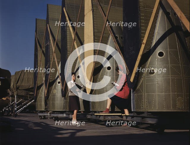 Carefully trained women inspectors check and..., Douglas Aircraft Company, Long Beach, Calif., 1942. Creator: Alfred T Palmer.