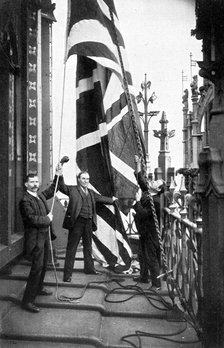 Hoisting the Union Jack, Houses of Parliament, Westminster, c1905. Artist: Unknown