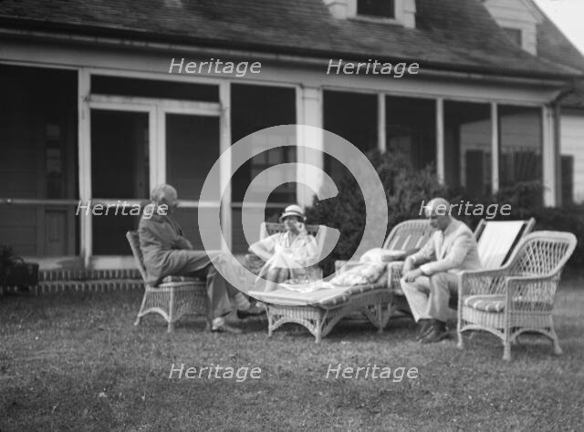 Sexton, Mr. and Mrs., and an unidentified man, seated outdoors, between 1932 and 1936. Creator: Arnold Genthe.