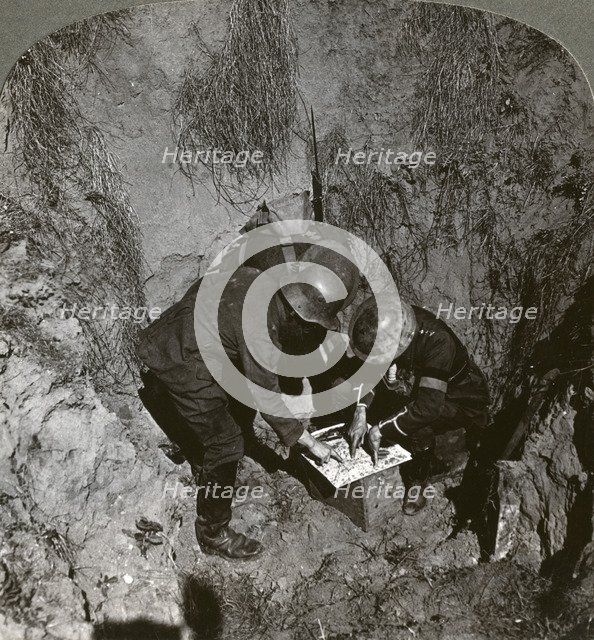 Captured German prisoner giving information to his captors, World War I, 1914-1918.Artist: Realistic Travels Publishers