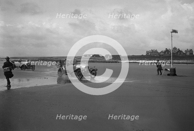 Bentley of ER Insole and Austin of RW Thomas competing in the Porthcawl Speed Trials, Wales, 1922. Artist: Bill Brunell.