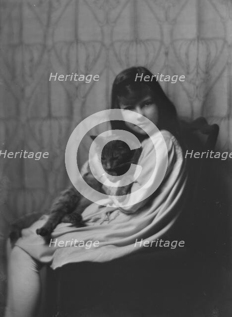 Daughter of Mrs. H Gamble, with cat, portrait photograph, 1917 Nov. 23. Creator: Arnold Genthe.