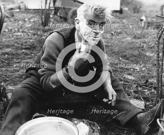 Gypsy man shaving, 1960s.