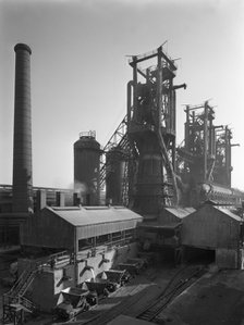 Molten steel being poured into rail trucks at the Stanton Steelworks, Ilkeston, Derbyshire, 1962. Artist: Michael Walters