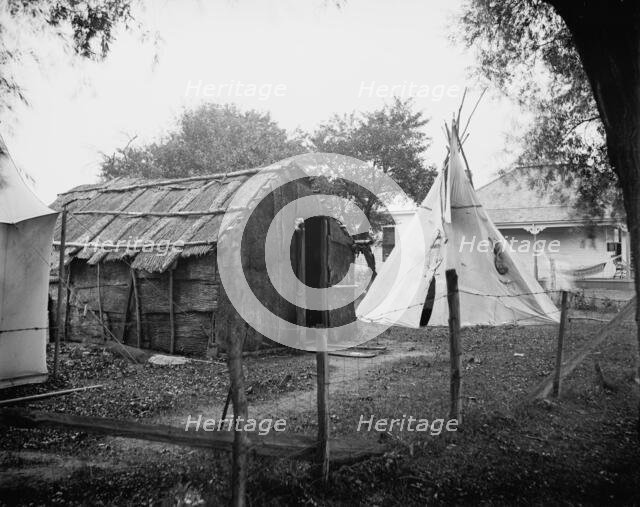 Hut and tepee, probably St. Clair Flats, Mich., between 1900 and 1920. Creator: Unknown.