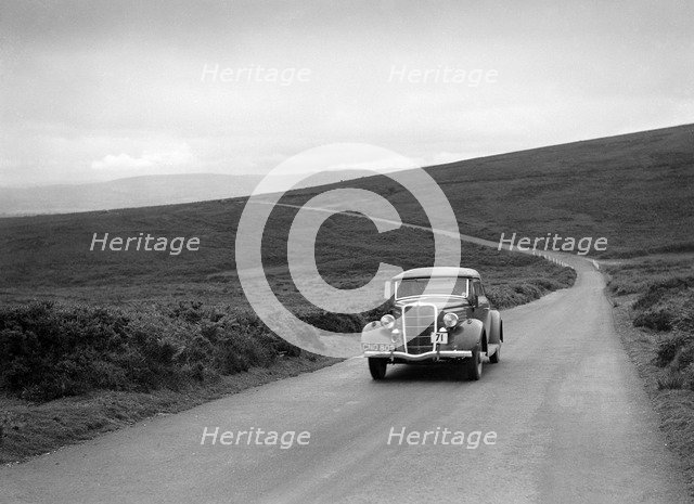 DJH Currie's Ford V8, winner of a silver award at the MCC Torquay Rally, July 1937. Artist: Bill Brunell.