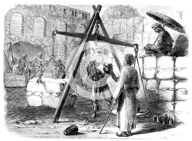 Weighing cotton at Bombay for the English market, 1862. Creator: Joseph Austin Benwell.