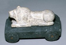 Limestone and bitumen lion mounted on a wheeled base, Susa, c12th century BC. Artist: Unknown