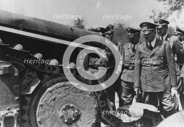 Adolf Hitler inspecting a destroyed French tank, France, World War II, 1940. Artist: Unknown