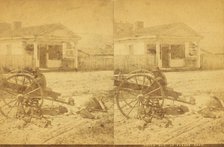 Uncle Bob at parade [rest?], [Man and children resting around an oxcart, in town], (1868-1900?). Creator: Unknown.