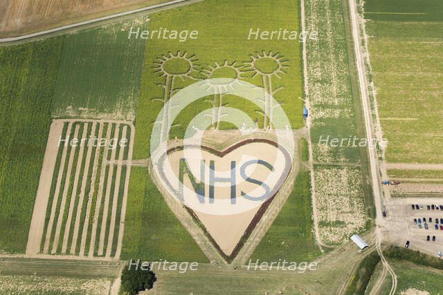 A field with flowers planted in the shape of a heart in support of the NHS, Hayling Island, 2020. Creator: Damian Grady.