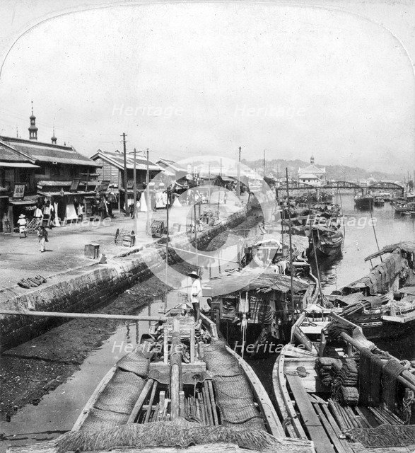 Native boats on a waterway in Yokohama, Japan, 1901.Artist: Clarence H White
