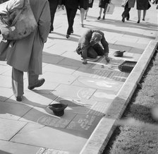 An ex-serviceman working as a pavement artist in central London, c1948-1959. Artist: John Gay