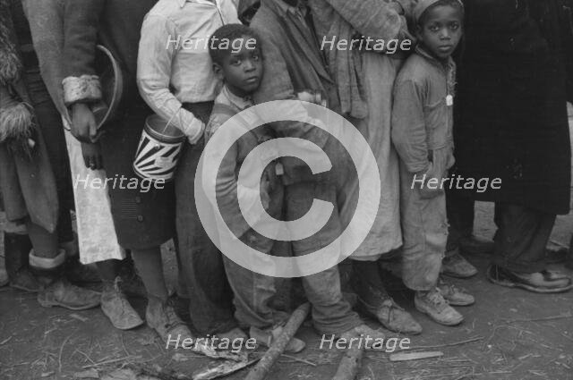 Flood refugees at mealtime, Forrest City, Arkansas, 1937. Creator: Walker Evans.