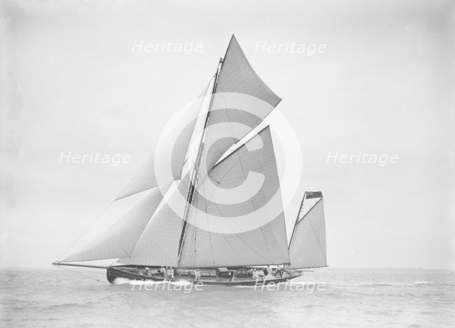 The yawl 'Joyce' sailing in good wind, 1911. Creator: Kirk & Sons of Cowes.