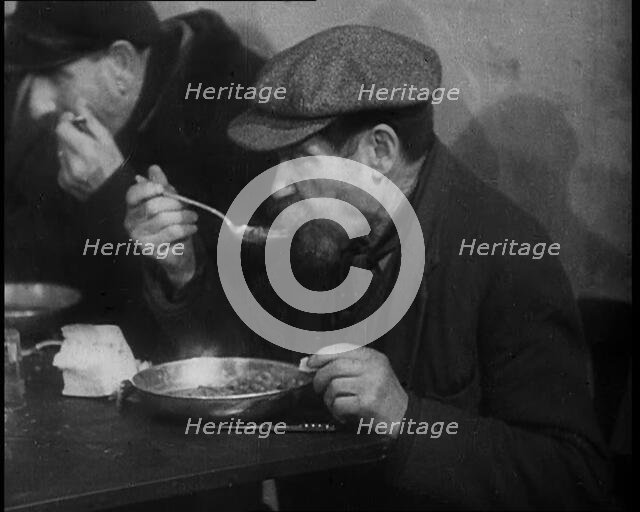 Two Men Eating Soup, 1933. Creator: British Pathe Ltd.