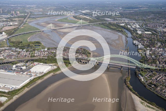 Road and rail bridges over the River Mersey and Manchester Ship Canal at Runcorn Gap, Halton, 2021. Creator: Damian Grady.