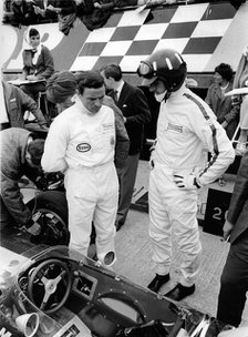 Jim Clark and Graham Hill in pits with Lotus 49 during 1967 British Grand Prix. Creator: Unknown.
