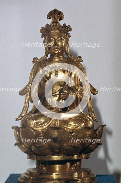 A gilt-bronze statuette of a Bodhisattva on a lotus leaf, 10th century. Artist: Unknown