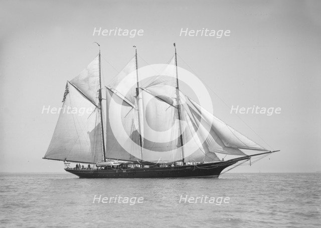The three-mast auxiliary schooner 'Invincible', 1911. Creator: Kirk & Sons of Cowes.