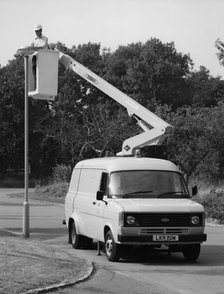 1981 Ford Transit 190 van with extending boom. Creator: Unknown.