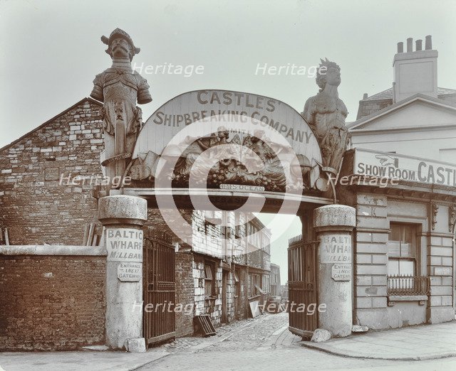 Ships' figureheads over the gate at Castle's Shipbreaking Yard, Westminster, London, 1909. Artist: Unknown.