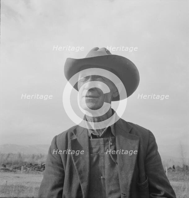Farmer from Nebraska now developing eighty-acre stump farm, Bonner County, Idaho, 1939. Creator: Dorothea Lange.