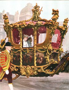 King George V and Queen Mary in the historic State Coach, c1935. Artist: Unknown.
