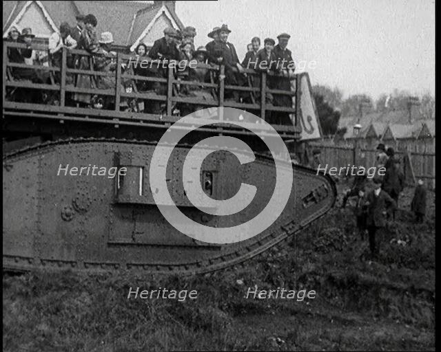 People Riding a Tank Over Rough Terrain, 1920. Creator: British Pathe Ltd.