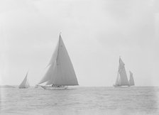 In the foreground the 23-metre cutter 'Astra' sailing on a reach. Creator: Kirk & Sons of Cowes.
