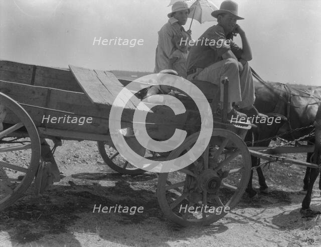 Drought-stricken farmer and family near Muskogee, Oklahoma, 1936. Creator: Dorothea Lange.
