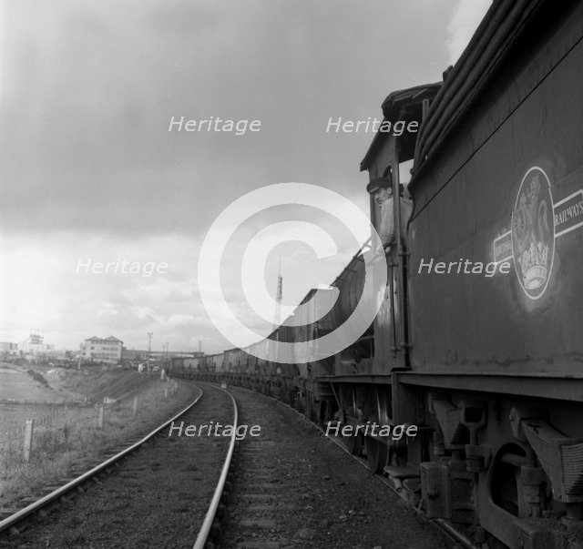 Steam loco no 65811 hauling coal from Lynemouth Colliery, Northumberland, 1963.  Artist: Michael Walters