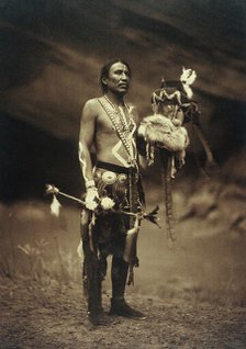 A Navajo man in ceremonial dress representing the Yebichai god Zahabolzi (Zahadolzha?), 1904. Creator: Edward Sheriff Curtis.