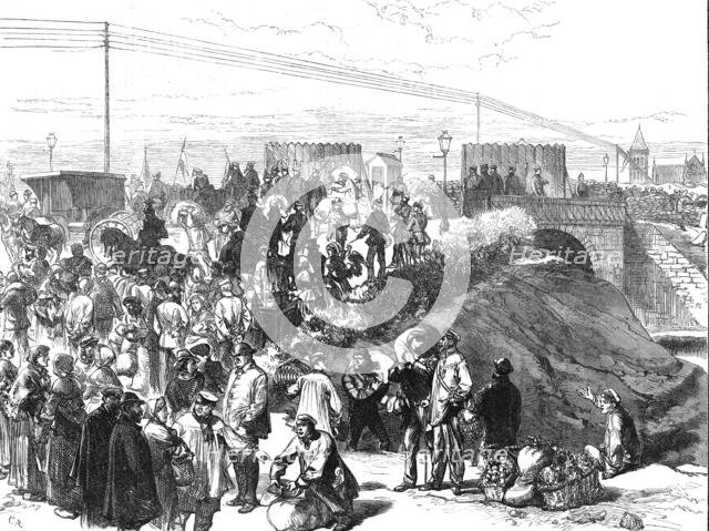 Relief of Paris: dealers in provisions...at the Prussian advanced post on the canal bridge, 1871. Creator: C. R..
