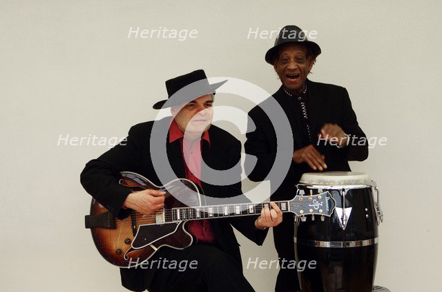Frank Holder, Guyanan jazz singer and percussionist with Shane Hill, guitarist.   Artist: Brian O'Connor