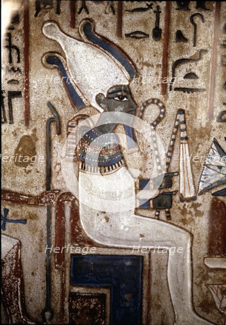 Funerary stela depicting the god Osiris, made in polychromed limestone. From Thebes.