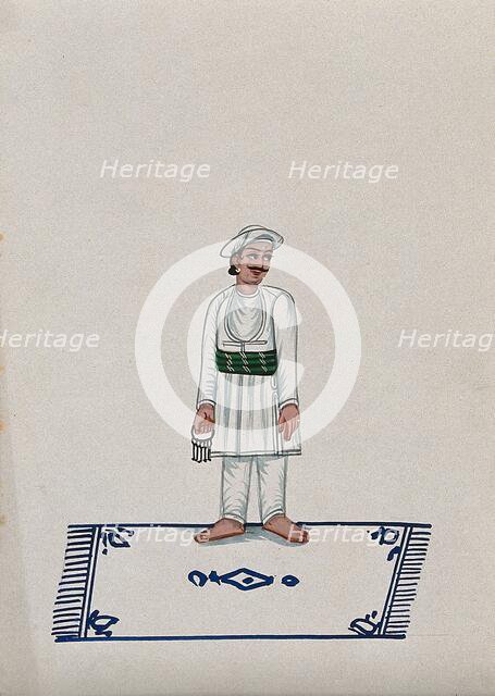 A servant standing on a carpet holding a bunch of keys, (between 1800 and 1899?). Creator: Unknown.