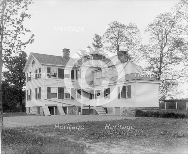 Calloway residence, back, showing porch with woman, Mamaroneck, N.Y., between 1900 and 1915. Creator: William H. Jackson.
