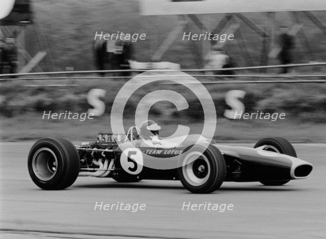 Jim Clark driving the Lotus 49 at the British Grand Prix, Silverstone, 1967. Artist: Unknown
