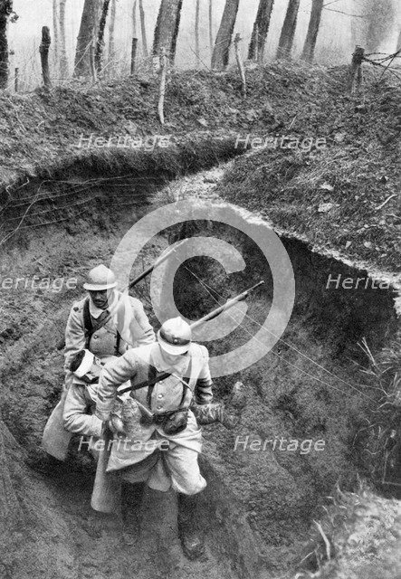 French soldiers carrying a wounded companion from the front, First World War, 1917, (c1920). Artist: Unknown