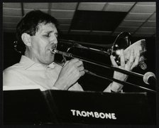 Trombonist Derek Wadsworth playing at The Fairway, Welwyn Garden City, Hertfordshire, 28 July 1991. Artist: Denis Williams